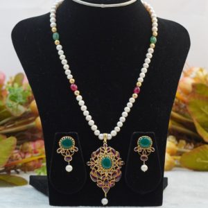 Elegant white pearl set jewelry with necklace and earrings